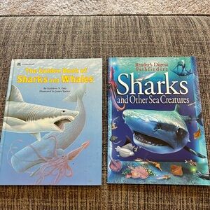 Two books about sharks and whales, One is a Golden book and one Reader’s Digest